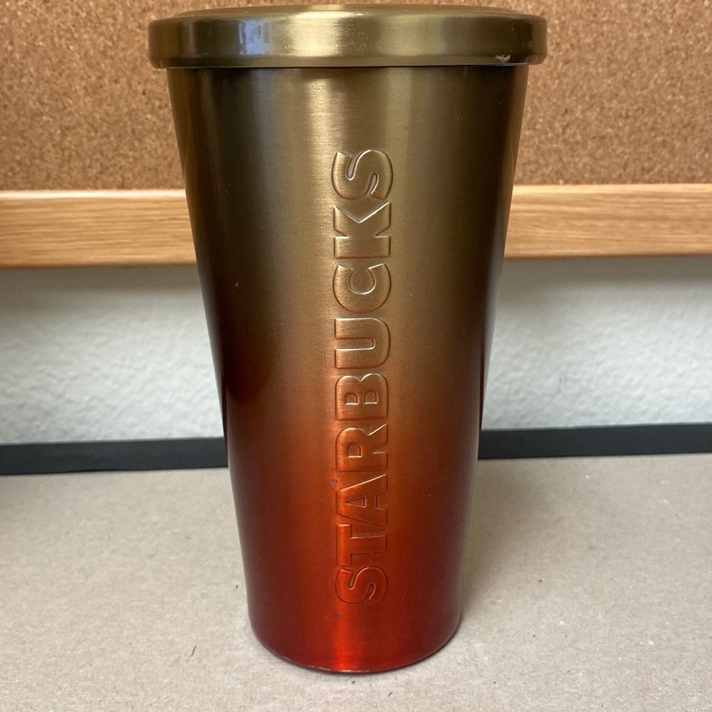 Starbucks red and gold ombré stainless steel tumbler.